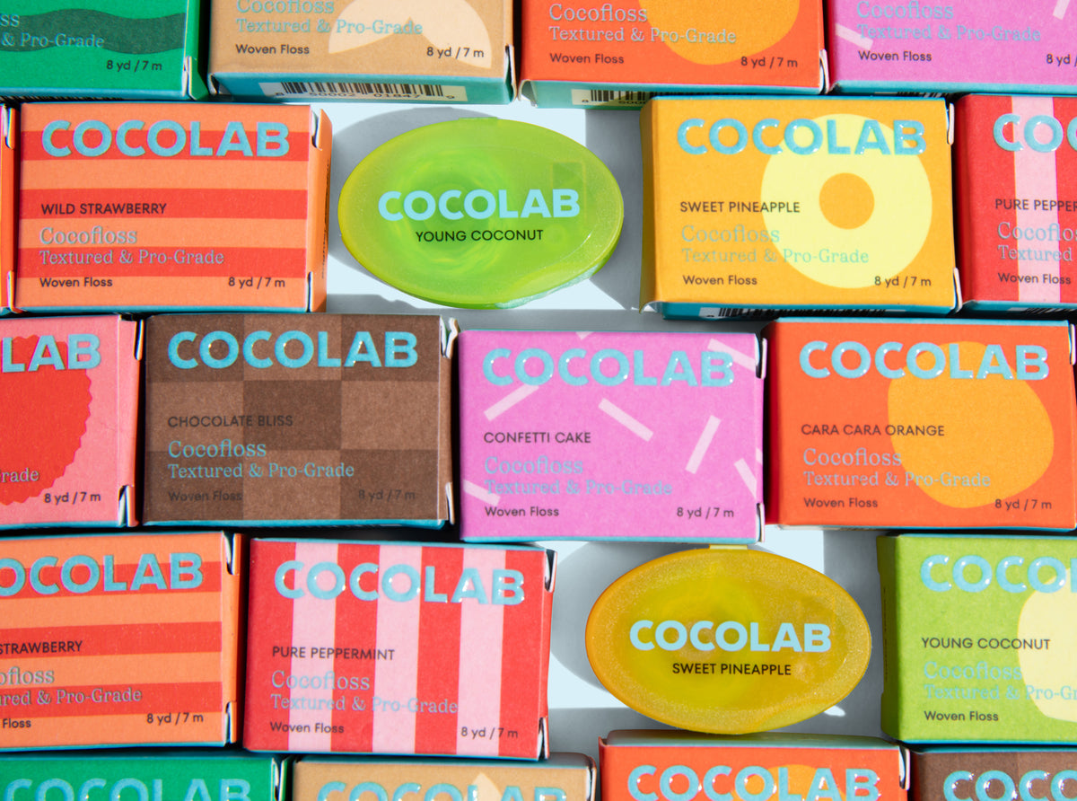 Assorted Cocolab soap bars in various colors and scents on a white background