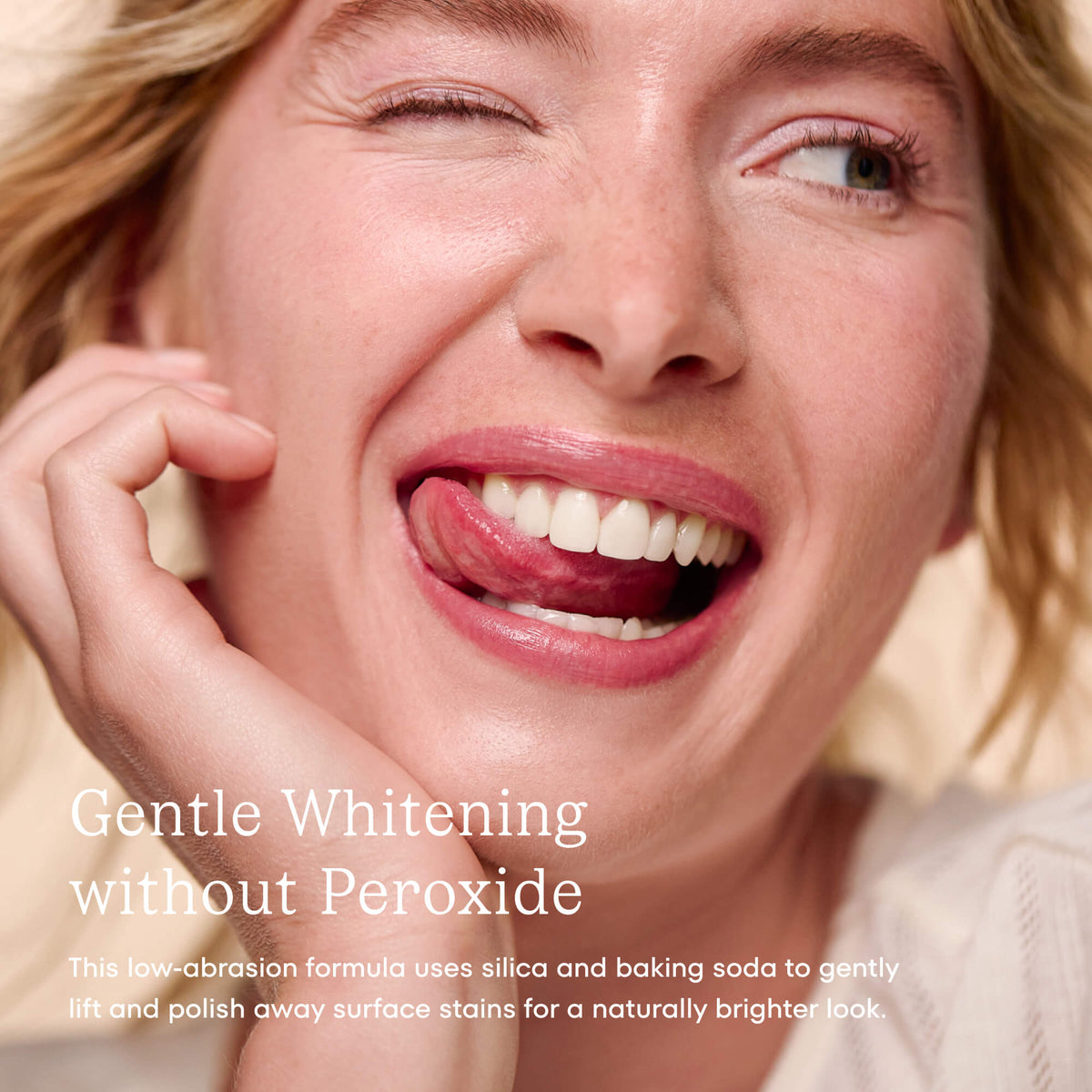 Close-up of a woman with a bright smile, promoting teeth whitening product.