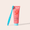 Cocoshine toothpaste tube with blue toothbrush on a light beige background