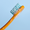 Orange toothbrush with blue bristles against a light blue background