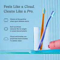 Two toothbrushes in a glass with promotional text about their cleaning effectiveness and environmental benefits on a blue background.