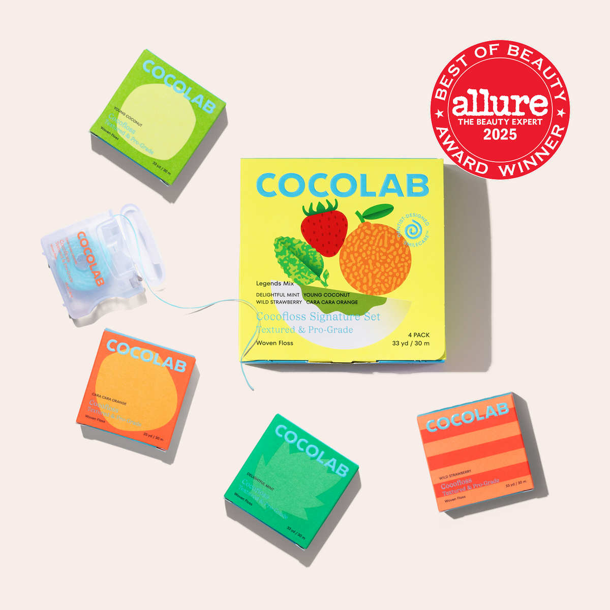 Cocolab product packaging with colorful designs and an Allure award badge on a light gray background