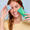 Woman holding a Cocolab Cocoshine and a toothbrush with a blue background