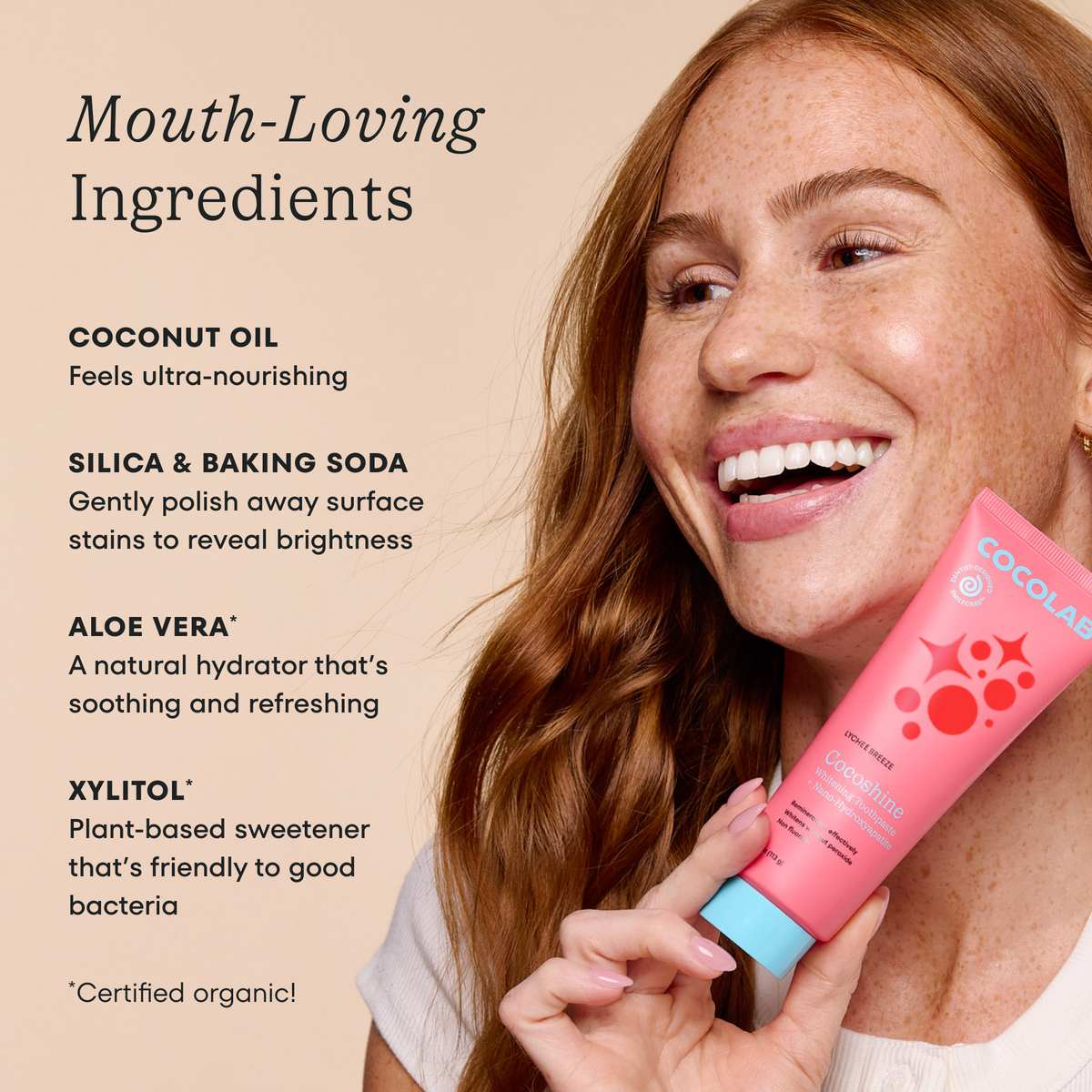 Woman holding a pink tube of COCOLAB product with text about mouth-loving ingredients on a beige background