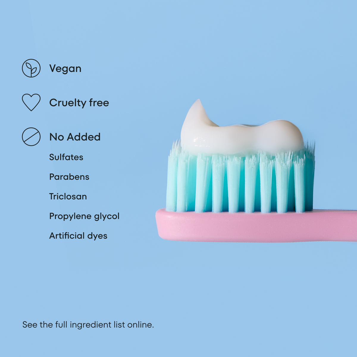Toothbrush with toothpaste on a blue background, featuring vegan and cruelty-free icons.